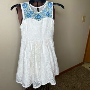 Beauties Dress embroidered flowers above chest & lace design throughout.